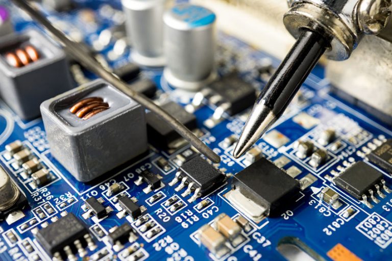 Repair microchip with soldering iron and tin